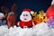 Christmas Santa and reindeer toys on snow with festive New Year balls