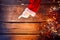 Christmas. Santa showing empty copyspace on a wooden background