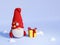 Christmas Scandinavian gnome with gift box and snow 3D render illustration.