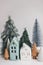 Christmas scene, miniature holiday village. Christmas little houses and trees on white background