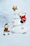 Christmas scene with Snowman and Santa Claus