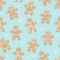 Christmas seamless pattern of smiling people from gingerbread. sweet cookies, delicious baked goods for the holiday