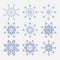 Christmas set of beautiful fragile snowflakes of blue color,