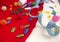 Christmas sewing still life includes fabric and craft supplies for creating festive decorations and ornaments