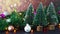 Christmas shiny decoration with blinking lights, Christmas ornaments and little pine trees