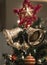 Christmas Silver bell and star hanging on a beautiful Chrismas t