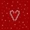 Christmas simple lite red background with realistic red and white cane candy forming a heart and golden stars. Xmas holiday cover