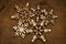 Christmas snowflake shape decoration made wood tree on canvas background