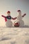 Christmas snowman couple with present box in basket