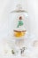 Christmas snowman cupcake under glass dome