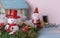 Christmas snowman,Santa and gifts decorated on grunge blue wood