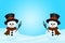 Christmas snowmans in snow with place for text