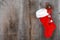 Christmas sock and wreath on wood