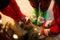 Christmas socks. Three pairs of foot, dressed in Xmas soks, stand around a tree. Atmosphere of Christmas.