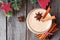 Christmas spiced eggnog, above view with decorations on wood