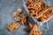 Christmas spices, gingerbread cookies and baking ingredients on grey concrete background. Cinnamon, anise stars, nutmeg, cardamon,