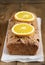 Christmas spicy cake with orange and cinnamon Holiday background Winter Fruit cake Vertical photo