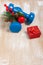 Christmas sport composition with dumbbells, red gift box, berries, spruce