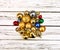 Christmas stack of Xmas balls decorations on white wooden boards