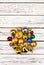 Christmas stack of Xmas balls decorations on white wooden boards