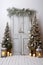 Christmas staged set with christmas trees fronting wooden door