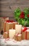 Christmas still life burning candles gift boxes and christmas tr