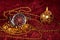 Christmas still life with candle and pocket watch on Burgundy background