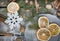 Christmas still life with delicious, almond, cinnamon, snowflakes on wooden table.