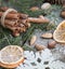 Christmas still life with delicious, almond, cinnamon, snowflakes on wooden table. Close up