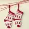 A Christmas stocking hanging on a red string