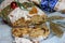 Christmas Stollen and cookies with apple mulled wine and Christmas lights. Traditional Sweet Fruit Loaf with icing sugar