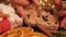 Christmas Stollen. Traditional christmas german dessert cut into pieces. Close-up female hand marking a cut off piece of stollen o