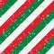 Christmas stripes seamless background. Diagonal red green peppermint with snow