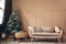 Christmas studio interior with decorated Christmas tree, gift boxes and cozy couch. New year and Christmas photo studio