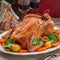 Christmas Stuffed Chicken Served with Potatoes, Carrots and Figs