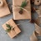Christmas sustainable holiday celebration background, crafted brown gift boxes, decorated with pine tree branch and cone