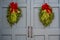 Christmas Swags Hanging on Gray Doors