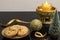 Christmas table decorations with scented candle and a plate of orange peel biscuits