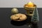 Christmas table decorations with scented candle and a plate of orange peel biscuits