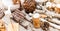 Christmas table place setting with christmas pine cones, wooden decorations, bokeh, snowflakes.