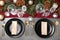 Christmas table setting with plates, cutlery, napkins and festive decor on grey background