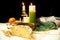 Christmas table with traditional food and candles on black background. Authentic east european dishes on the festive table.