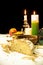 Christmas table with traditional food and candles on black background. Authentic east european dishes on the festive table.