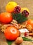 Christmas tangerines with sweet delights, walnuts, pinecone and