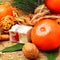 Christmas tangerines with sweet delights, walnuts, pinecone and