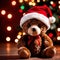 Christmas teddy bear wearing santa hat under christmas tree