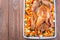 Christmas or Thanksgiving roasted turkey with vegetables, carrot, parsnip, potato on a tray, horizontal, top view, copy space