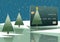 A Christmas themed credit card with a tree topped with a star is seen on snow next to a lake with more similar looking trees growi