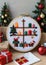 A Christmas-Themed Cross-Stitch Pattern, In A Cozy Crafting Area. Generative AI