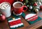 Christmas-Themed Quilted Coasters On A Table, With A Mug Of Hot Cocoa. Generative AI